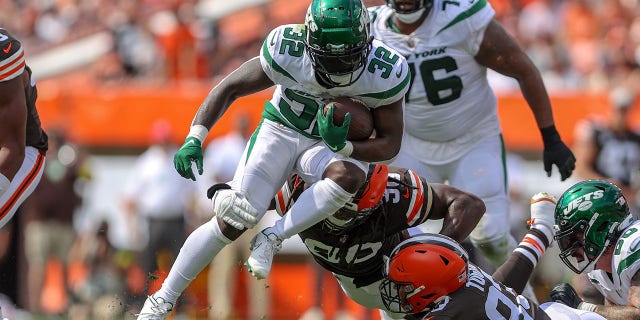New York Jets running back Michael Carter carries the football during the Browns game on Sept. 18, 2022, at FirstEnergy Stadium in Cleveland.