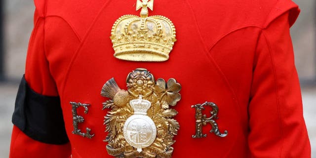 The cypher of Queen Elizabeth II is depicted in the uniform of the Royal Guard at Westminster Abbey in London on September 19, 2022.