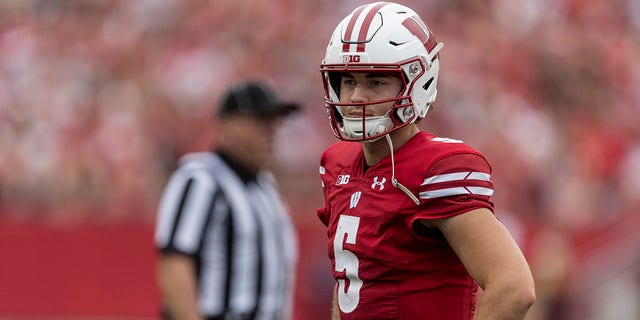 Wisconsin Badgers quarterback Graham Mertz, #5, looks to the sideline durning a break in the action in a college football game between the New Mexico State Aggies and the Wisconsin Badgers on Sept. 17th, 2022 at Barry Alvarez field in Camp Randall Stadium in Madison, Wisconsin. 