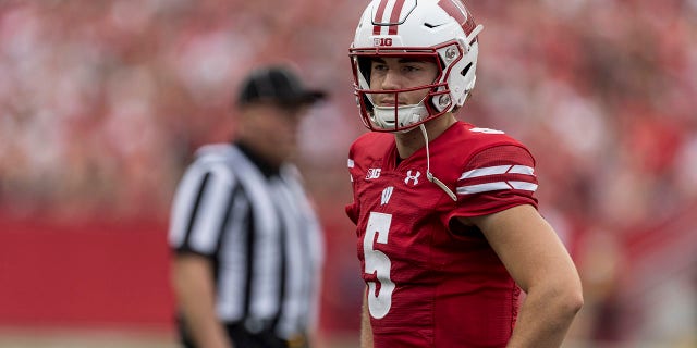 Wisconsin Badgers quarterback Graham Mertz, #5, looks to the sideline durning a break in the action in a college football game between the New Mexico State Aggies and the Wisconsin Badgers on Sept. 17th, 2022 at Barry Alvarez field in Camp Randall Stadium in Madison, Wisconsin. 