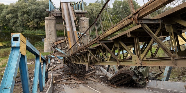 Izium, Ukraine - September 20: Russian tanks and a destroyed bridge are seen on September 20, 2022 in Izium, Ukraine. 