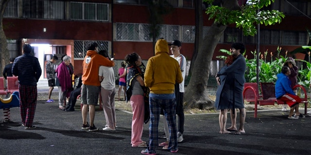 People are seen at the Tlatelolco neighborhood after a 6.8-magnitude earthquake in Mexico City on September 22, 2022.