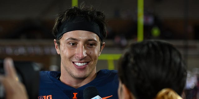 Illinois QB Tommy DeVito, #3, being interviewed by Big Ten Network sideline reporter Elise Menaker following a college football game between the Chattanooga Mocs and Illinois Fighting Illini on Sept. 22, 2022 at Memorial Stadium in Champaign, Illinois.  