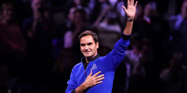 Roger Federer gestures to the crowd on the first day of the Laver Cup at the O2 Arena, London, Sept. 23, 2022.