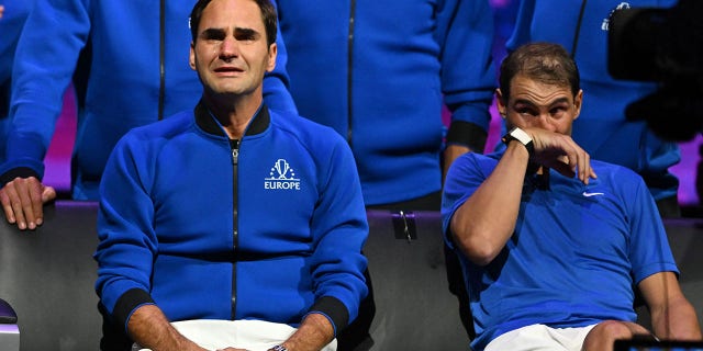 Switzerland's Roger Federer (L) sheds a tear after playing his final match, a doubles with Spain's Rafael Nadal (R) of Team Europe against USA's Jack Sock and USA's Frances Tiafoe of Team World in the 2022 Laver Cup at the O2 Arena in London, early on Sept. 24, 2022.