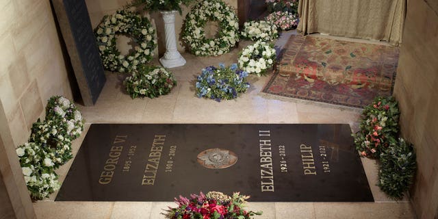In this image released by the Buckingham Palace, the ledger stone, following the interment of the late Queen Elizabeth II, is installed at the King George VI Memorial Chapel, St George's Chapel, Windsor Castle on Sept. 24, 2022 in Windsor, England. 