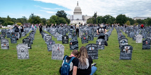 People who lost loved ones to drug overdoses set up imitation graves near the U.S. Capitol Sept. 24.