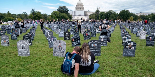 People who lost loved ones to drug overdoses set up imitation graves near the U.S. Capitol Sept. 24.