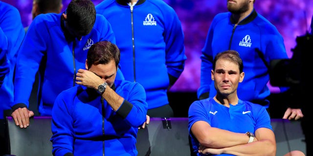 Team Europe player Roger Federer of Switzerland front L, Rafael Nadal front R of Spain, Novak Djokovic 1st L, Rear of Serbia react at the end of Roger Federer's last match after Federer announced his retirement at the Laver Cup in London, Britain, Sept. 24, 2022.