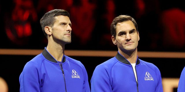 Team Europe's Serbian player Novak Djokovic L and Swiss player Roger Federer attend the trophy ceremony after the Laver Cup tennis tournament between Team World and Team Europe in London, Britain, on Sept. 26, 2022. 