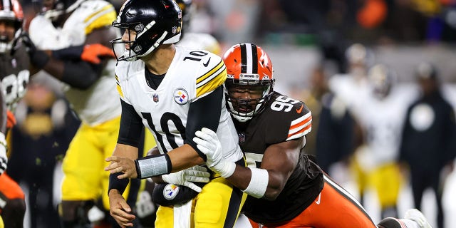Browns defensive end Myles Garrett hits Pittsburgh Steelers quarterback Mitch Trubisky on Sept. 22, 2022, in Cleveland.