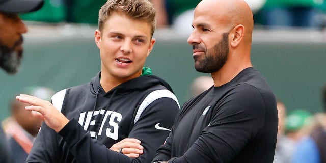 New York Jets quarterback Zach Wilson, left, and New York Jets head coach Robert Saleh talk prior to a game between against the Cincinnati Bengals Sept. 25, 2022, at MetLife Stadium in East Rutherford, N.J.  