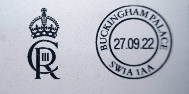 A detailed view of a letter franked with the new cypher of King Charles III at the Court Post Office at Buckingham Palace on Sept. 27, 2022, in London.