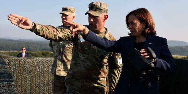 US Vice President Kamala Harris, right, looks towards the north side of the border at the Demilitarized Zone (DMZ).