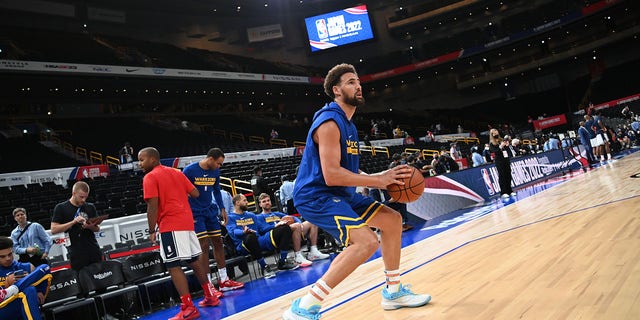 Klay Thompson, #11 of the Golden State Warriors, warms up against the Washington Wizards as part of the 2022 Japan Games at Saitama Super Arena on September 30, 2022, in Saitama, Japan. 