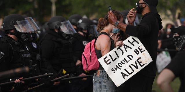 AURORA, CO - JUNE 27: Elijah McClain protesters close to the Aurora place line at the Aurora Municipal Center June 27, 2020. Elijah McClain died August 30, 2019 several days after a struggle with Aurora police. Elijah became unconscious during the encounter with police August 24, 2019 and had a heart attack while being transported to a hospital. McClain died after being taken off life support. (Photo by Andy Cross/MediaNews Group/The Denver Post via Getty Images)"n"n