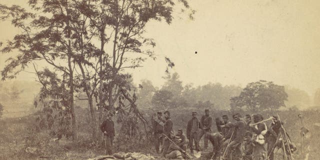 Burying the dead on the Battlefield of Antietam, September 1862; artist, Alexander Gardner. The Union victory came at great cost but gave Abraham Lincoln the political capital to announce the coming end of slavery.