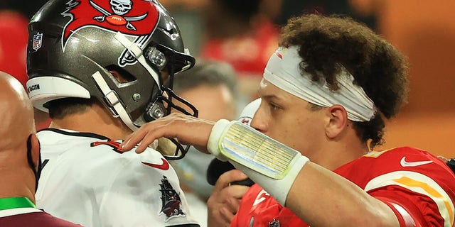 Tom Brady of the Tampa Bay Buccaneers, left, and Patrick Mahomes of the Kansas City Chiefs speak after Super Bowl LV at Raymond James Stadium Feb. 7, 2021, in Tampa, Fla. The Buccaneers defeated the Chiefs 31-9. 