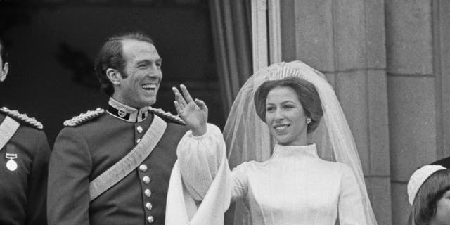 Princess Anne and Mark Phillips pose on the balcony of Buckingham Palace in London after their wedding in November 1973. They split in 1992.