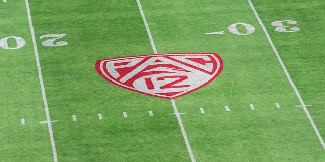 The Pac 12 logo on a football field