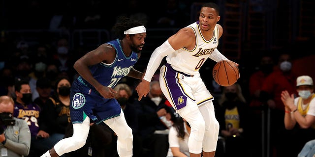 Russell Westbrook of the Lakers handles the ball against Patrick Beverley of the Minnesota Timberwolves at Crypto.com Arena in Los Angeles on January 2, 2022.