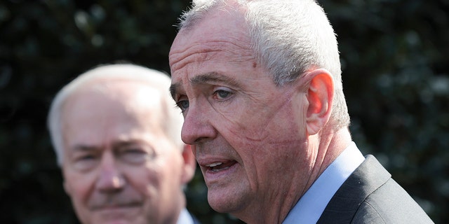 New Jersey Gov. Phil Murphy and Arkansas Gov. Asa Hutchinson, Chairman of the National Governors Association, speak outside the White House after a meeting with President Joe Biden and members of the National Governors Association on January 31, 2022, in Washington, D.C. 
