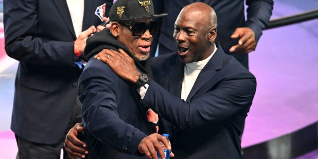 Dennis Rodman, left, and Michael Jordan pose for photos after the introduction of the NBA 75th anniversary team during the 2022 NBA All-Star Game at Rocket Mortgage Fieldhouse in Cleveland, Ohio, on Feb. 20, 2022.