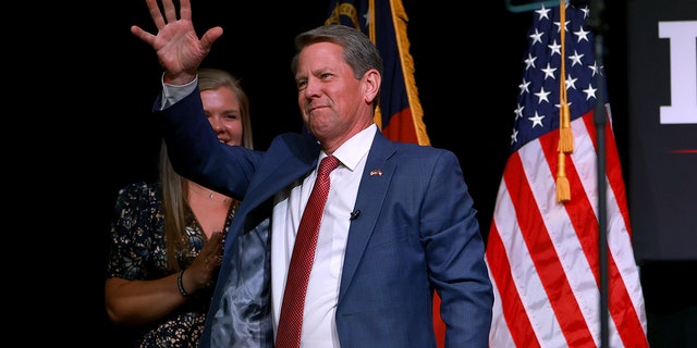 Incumbent Republican Governor Brian Kemp waves at his first election party at the Chick-fil-A College Football Hall of Fame on May 24, 2022 in Atlanta, Georgia.