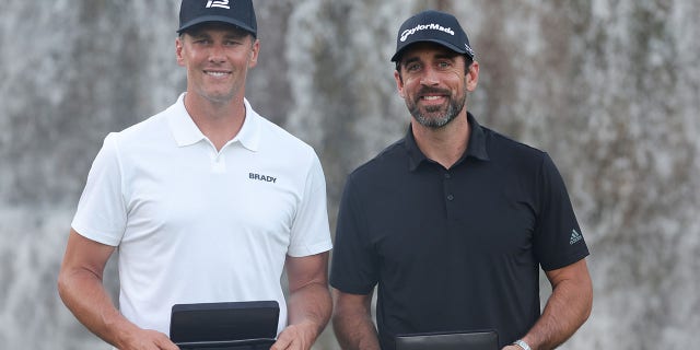 Tom Brady and Aaron Rodgers celebrate winning after Capital One's The Match VI at Wynn Golf Club on June 1, 2022, in Las Vegas, Nevada.
