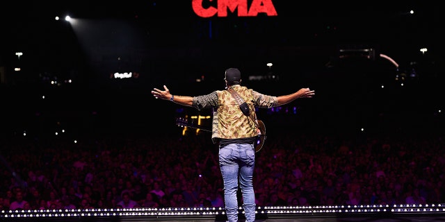 Luke Bryan is excited to share the CMA stage with Peyton Manning as his co-host.