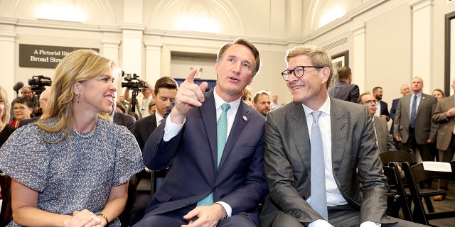 Virginia Gov. Glenn Youngkin, center, and the CEO of The Lego Group Niels B. Christiansen, right, attend a press event where The LEGO Group is announcing to build a US $1 billion, carbon-neutral run factory in Virginia, USA.