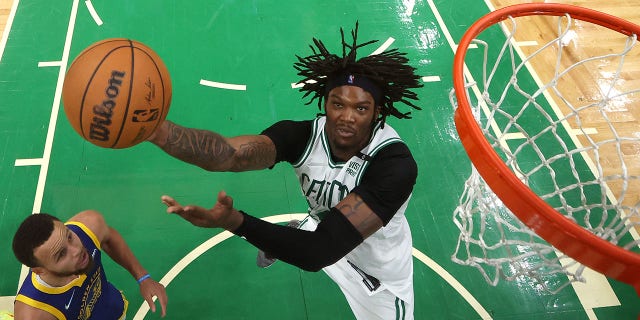 Robert Williams III of the Boston Celtics shoots against the Golden State Warriors in Game 6 of the 2022 NBA Finals at TD Garden June 16, 2022, in Boston.