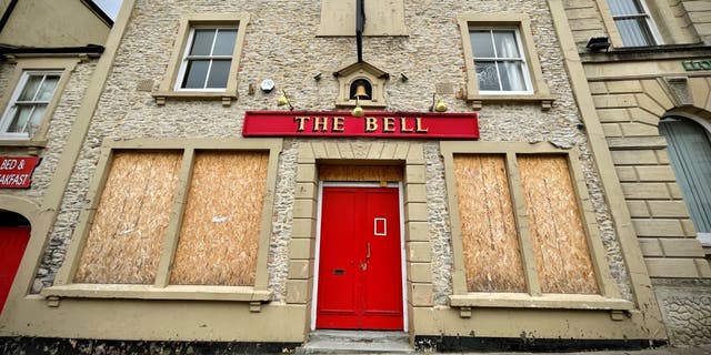  A pub, which has closed its doors to customers, has its windows boarded-up in Shepton Mallet, on July 25, 2022, in Somerset, England. Since the year 2000, a quarter of pubs have closed in the UK, totalling more than 13,000 locations. 