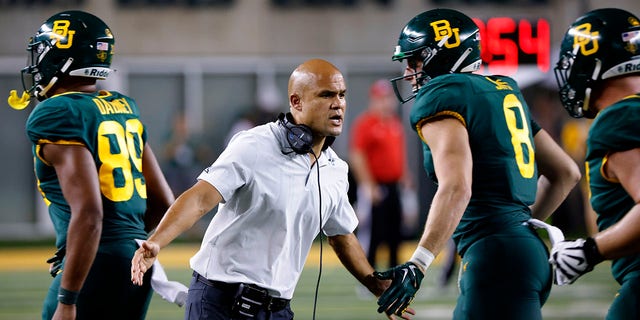 Head coach Dave Aranda of the Baylor Bears welcomes his players to the sidelines against the Albany Great Danes at McLane Stadium Sept. 3, 2022, in Waco, Texas. 