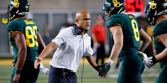 Head coach Dave Aranda of the Baylor Bears welcomes his players to the sidelines against the Albany Great Danes at McLane Stadium Sept. 3, 2022, in Waco, Texas. 