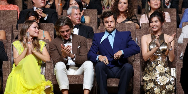 Harry Styles sitting next to Chris Pine during a screening of "Don't worry darling."