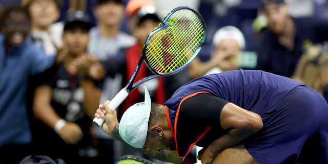 Nick Kyrgios of Australia smashes his racquet after being defeated by Karen Khachanov in a US Open 2022 men's quarterfinal match at the USTA Billie Jean King National Tennis Center September 6, 2022 in the Flushing borough of the Queens borough of New York.