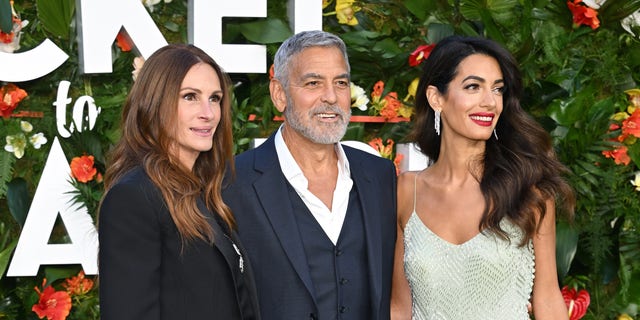 Julia Roberts, Amal Clooney and George Clooney attend the "Ticket To Paradise" world premiere in London in September.