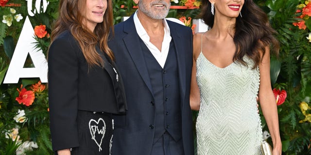 Julia Roberts, Amal Clooney and George Clooney attend the "Ticket To Paradise" world premiere in London in September.