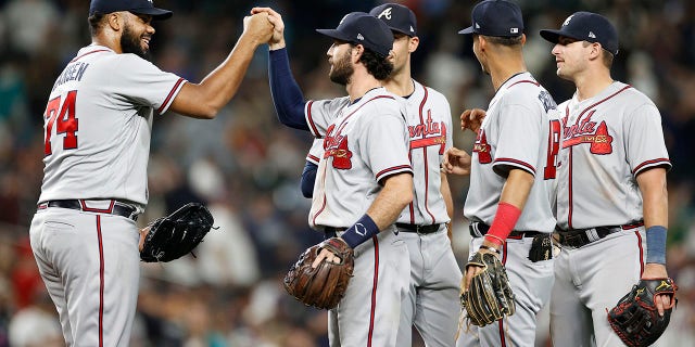 Kenley Jansen (74) of the Atlanta Braves celebrates the final out with teammates against the Seattle Mariners after a 6-4 win at T-Mobile Park Sept. 9, 2022, in Seattle.