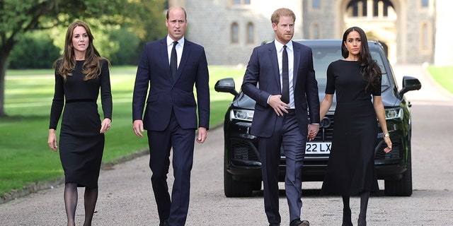 Catherine, Princess of Wales, Prince William, Prince of Wales, Prince Harry, Duke of Sussex, and Meghan, Duchess of Sussex, on the long Walk at Windsor Castle on September 10, 2022, in Windsor, England. Crowds have gathered and left tributes at the gates of Windsor Castle to Queen Elizabeth II, who died at Balmoral Castle on September 8, 2022.