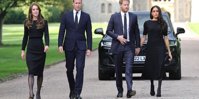 Catherine, Princess of Wales, Prince William, Prince of Wales, Prince Harry, Duke of Sussex, and Meghan, Duchess of Sussex, on the long Walk at Windsor Castle on September 10, 2022, in Windsor, England. Crowds have gathered and left tributes at the gates of Windsor Castle to Queen Elizabeth II, who died at Balmoral Castle on September 8, 2022.