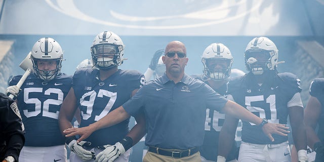 Head coach James Franklin of the Penn State Nittany Lions leads his team onto the field before a game against the Ohio Bobcats at Beaver Stadium Sept. 10, 2022, in State College, Pa. 
