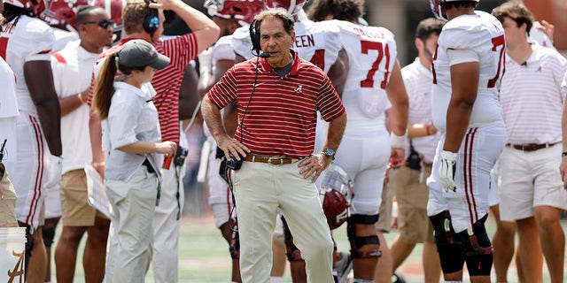 Head coach Nick Saban of the Alabama Crimson Tide talks on his headset during a timeout in the fourth quarter against the Texas Longhorns at Darrell K Royal-Texas Memorial Stadium Sept. 10, 2022, in Austin, Texas. 
