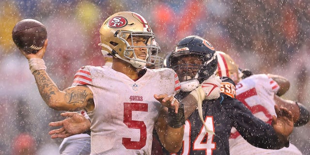 Trey Lance throws in the rain