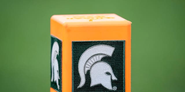 The Michigan State Spartans logo is pictured on a pylon during the game against the Akron Zips. Michigan State University's president acknowledged a "moment of uncertainty" on campus.
