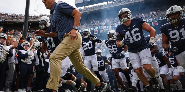 Head coach James Franklin leads the Penn State Nittany Lions onto the field before the Ohio Bobcats game at Beaver Stadium on Sept. 10, 2022, in State College, Pennsylvania. 