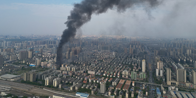 Flames and smoke rise from a 218-meter-tall office building on September 16, 2022 in Changsha, Hunan Province of China. A major fire broke out in the skyscraper in Changsha city on Friday afternoon. No casualties have been reported so far. 