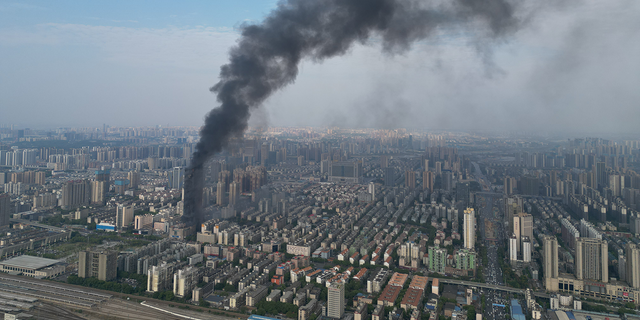 Flames and smoke rise from a 218-meter-tall office building on September 16, 2022 in Changsha, Hunan Province of China. A major fire broke out in the skyscraper in Changsha city on Friday afternoon. No casualties have been reported so far. 