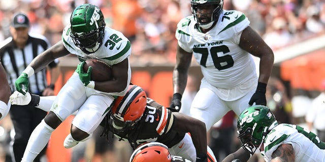 Michael Carter of the New York Jets runs with the ball against the Browns at FirstEnergy Stadium on Sept. 18, 2022, in Cleveland, Ohio.
